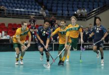 Six locals pull on the green and gold