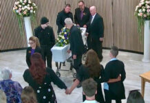 Tributes flow for adopted son lost in “broken” system